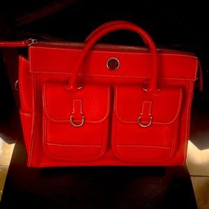 Dooney and  Bourke red satchel purse. BRAND NEW. NEVER USED.